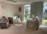Bright, modern counselling room with seating and natural light in Bracken